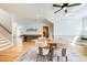 Open-concept game room with a dining table, game table, and a staircase leading to other areas at 3204 Waterway Blvd, Isle of Palms, SC 29451