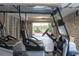 Inside the garage, a golf cart is parked with a view of the outdoors at 3204 Waterway Blvd, Isle of Palms, SC 29451