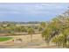 Scenic golf course views with lush greenery and waterfront backdrop enhance this lovely home's appeal at 3204 Waterway Blvd, Isle of Palms, SC 29451