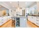Gourmet kitchen features a large center island, granite countertops and stainless steel appliances at 3204 Waterway Blvd, Isle of Palms, SC 29451