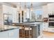 Bright and airy kitchen with granite countertops, stainless steel appliances, and a wine storage rack at 3204 Waterway Blvd, Isle of Palms, SC 29451