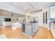 Gourmet kitchen with granite countertops, stainless steel appliances, and a large kitchen island at 3204 Waterway Blvd, Isle of Palms, SC 29451