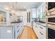 Modern kitchen with stainless steel appliances, granite countertops, and an open layout perfect for entertaining at 3204 Waterway Blvd, Isle of Palms, SC 29451