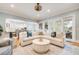 Bright, open-concept living room with a comfortable sectional sofa, stylish decor, and seamless connection to the gourmet kitchen at 3204 Waterway Blvd, Isle of Palms, SC 29451