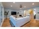 Bright, modern living room featuring a fireplace, large windows, and stylish white sofa at 3204 Waterway Blvd, Isle of Palms, SC 29451