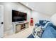 Upstairs living room with sectional couch, large screen tv, storage console and popcorn machine at 3204 Waterway Blvd, Isle of Palms, SC 29451