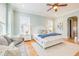 Bright main bedroom with a comfortable sitting area, natural light, and hardwood floors at 3204 Waterway Blvd, Isle of Palms, SC 29451