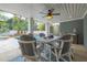 Inviting covered patio featuring a dining table and view of the backyard pool and deck at 3204 Waterway Blvd, Isle of Palms, SC 29451