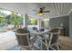 Covered patio with a ceiling fan and large dining table, offering an outdoor entertaining space at 3204 Waterway Blvd, Isle of Palms, SC 29451