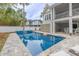 Beautiful in-ground pool with clear blue water, stylish patio, and serene backyard setting for relaxation at 3204 Waterway Blvd, Isle of Palms, SC 29451