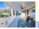 Charming porch with comfy chairs and a ceiling fan, perfect for enjoying the serene surroundings at 3204 Waterway Blvd, Isle of Palms, SC 29451