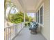 Relaxing second story porch with comfortable seating and picturesque views, perfect for enjoying the tranquil surroundings at 3204 Waterway Blvd, Isle of Palms, SC 29451