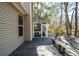 Outdoor deck with bench and a view of the fenced backyard and sunroom at 3425 Oxfordshire Ln, Mount Pleasant, SC 29466