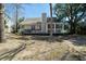 Backyard with a deck, grill, and an enclosed sunroom at 3425 Oxfordshire Ln, Mount Pleasant, SC 29466