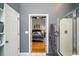 Bathroom doorway leading to a light-filled bedroom with hardwood floors at 3425 Oxfordshire Ln, Mount Pleasant, SC 29466