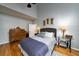 Spacious bedroom with hardwood floors, a large window, and ample natural light at 3425 Oxfordshire Ln, Mount Pleasant, SC 29466