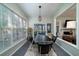 Sunlit dining room with large windows and an adjacent sitting area at 3425 Oxfordshire Ln, Mount Pleasant, SC 29466