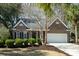 Charming single-story brick home with manicured landscaping and an attached two-car garage at 3425 Oxfordshire Ln, Mount Pleasant, SC 29466