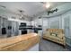 Bright kitchen featuring stainless appliances and cozy seating area with a floral sofa at 3425 Oxfordshire Ln, Mount Pleasant, SC 29466