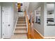 Bright foyer showcases hardwood floors and a carpeted staircase at 3425 Oxfordshire Ln, Mount Pleasant, SC 29466