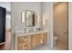 A bathroom features a sink with a modern vanity and marble countertop, as well as a doorway to the toilet at 40 Pitt St, Charleston, SC 29401