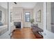 Bright bedroom featuring hardwood floors, a fireplace and a bench under a window at 40 Pitt St, Charleston, SC 29401