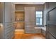 Spacious closet with custom shelving and window seat at 40 Pitt St, Charleston, SC 29401