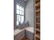 Custom closet featuring window seat and built-in shelving at 40 Pitt St, Charleston, SC 29401