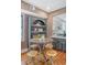 Dining area featuring a round table with seating for four, plus a built-in bookcase for stylish storage at 40 Pitt St, Charleston, SC 29401