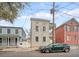 Urban home featuring double porches, neutral siding, and traditional architectural design in a close community at 40 Pitt St, Charleston, SC 29401