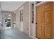 Charming front porch featuring painted flooring, exterior door with transom and a view to the neighborhood at 40 Pitt St, Charleston, SC 29401