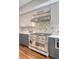 A modern kitchen features stainless steel appliances, custom cabinetry, and designer tile work for a stylish cooking experience at 40 Pitt St, Charleston, SC 29401