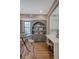 Charming kitchen features an arched shelving unit, a round table, and a seamless connection to modern amenities at 40 Pitt St, Charleston, SC 29401