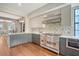 An open-concept kitchen boasts stainless steel appliances and countertops, perfect for cooking and entertaining at 40 Pitt St, Charleston, SC 29401