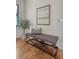 Living space that features a bench, a plant, a painting, hardwood floors, and great lighting at 40 Pitt St, Charleston, SC 29401