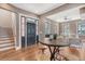 Spacious living area features hardwood flooring, a large front door and an open concept layout at 40 Pitt St, Charleston, SC 29401