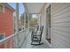 Outdoor porch with rocking chairs and peaceful neighborhood views at 40 Pitt St, Charleston, SC 29401