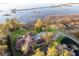 Aerial view of waterfront estate showing manicured lawns, swimming pool, private pier, and surrounding marsh at 4009 Ballovista Rd, Johns Island, SC 29455