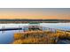 Aerial view showcasing the property's private dock, complete with a covered bar and pier access to the tranquil waterfront at 4009 Ballovista Rd, Johns Island, SC 29455