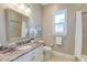 Well-lit bathroom featuring vanity with granite countertops and framed mirror at 4009 Ballovista Rd, Johns Island, SC 29455