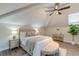 Cozy bedroom with a plush bed, a ceiling fan, and a window providing natural light at 4009 Ballovista Rd, Johns Island, SC 29455