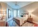 Inviting bedroom with a ceiling fan and hardwood flooring at 4009 Ballovista Rd, Johns Island, SC 29455