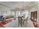 Bright and spacious dining room with a chandelier and view to the living room at 4009 Ballovista Rd, Johns Island, SC 29455