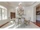 Bright dining room with hardwood floors, a stone table, and a chandelier at 4009 Ballovista Rd, Johns Island, SC 29455