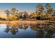 Waterfront home featuring lush landscaping and stunning views, ideal for tranquil living and entertaining at 4009 Ballovista Rd, Johns Island, SC 29455