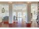 Elegant entryway showcasing gleaming hardwood floors and a light-filled living space with neutral tones at 4009 Ballovista Rd, Johns Island, SC 29455