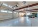 Spacious garage with multiple doors, high ceilings, and ample storage space, perfect for car enthusiasts or a workshop at 4009 Ballovista Rd, Johns Island, SC 29455