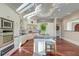 Bright, modern kitchen with stainless steel appliances, marble countertops, and hardwood floors at 4009 Ballovista Rd, Johns Island, SC 29455