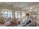 Bright, open-concept living and dining area with hardwood floors, marsh view, and elegant furnishings at 4009 Ballovista Rd, Johns Island, SC 29455