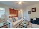 Comfortable living room with a white sofa, stylish decor, and wood floors creating a warm atmosphere at 4009 Ballovista Rd, Johns Island, SC 29455
